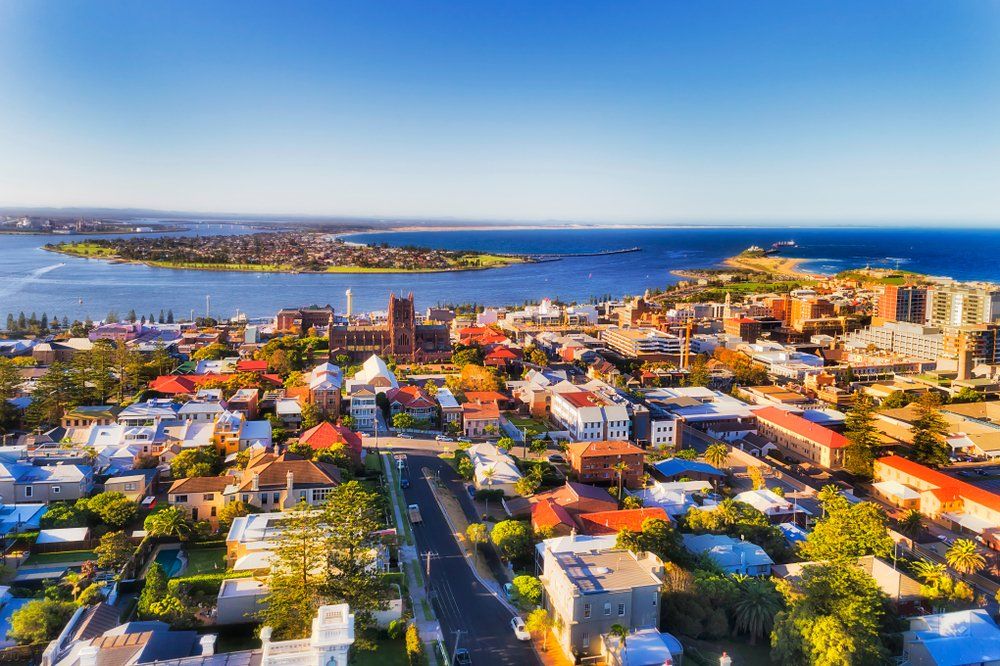Aerial View Of A Coastal City With Colourful Buildings — Refrigeration & Air Conditioning in Newcastle, NSW