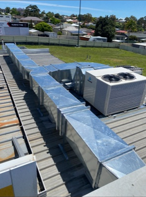 The Roof Of A Building With A Lot Of Ducts On It — Refrigeration & Air Conditioning in Jewells, NSW