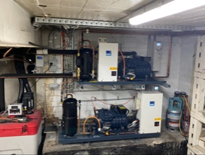 Two Large Industrial Refrigeration Units In A Utility Room — Refrigeration & Air Conditioning in Jewells, NSW