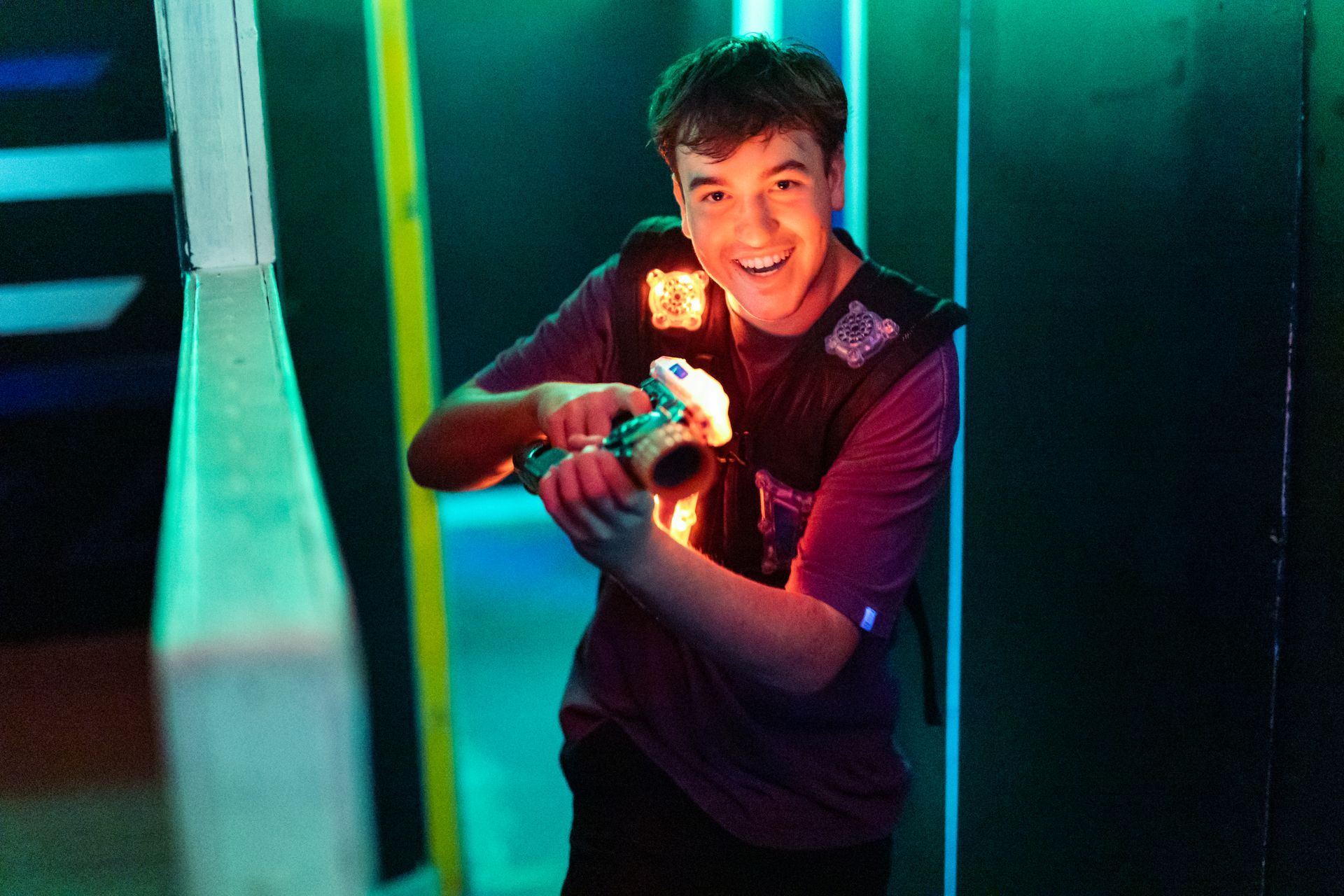 Teenager having fun playing laser tag