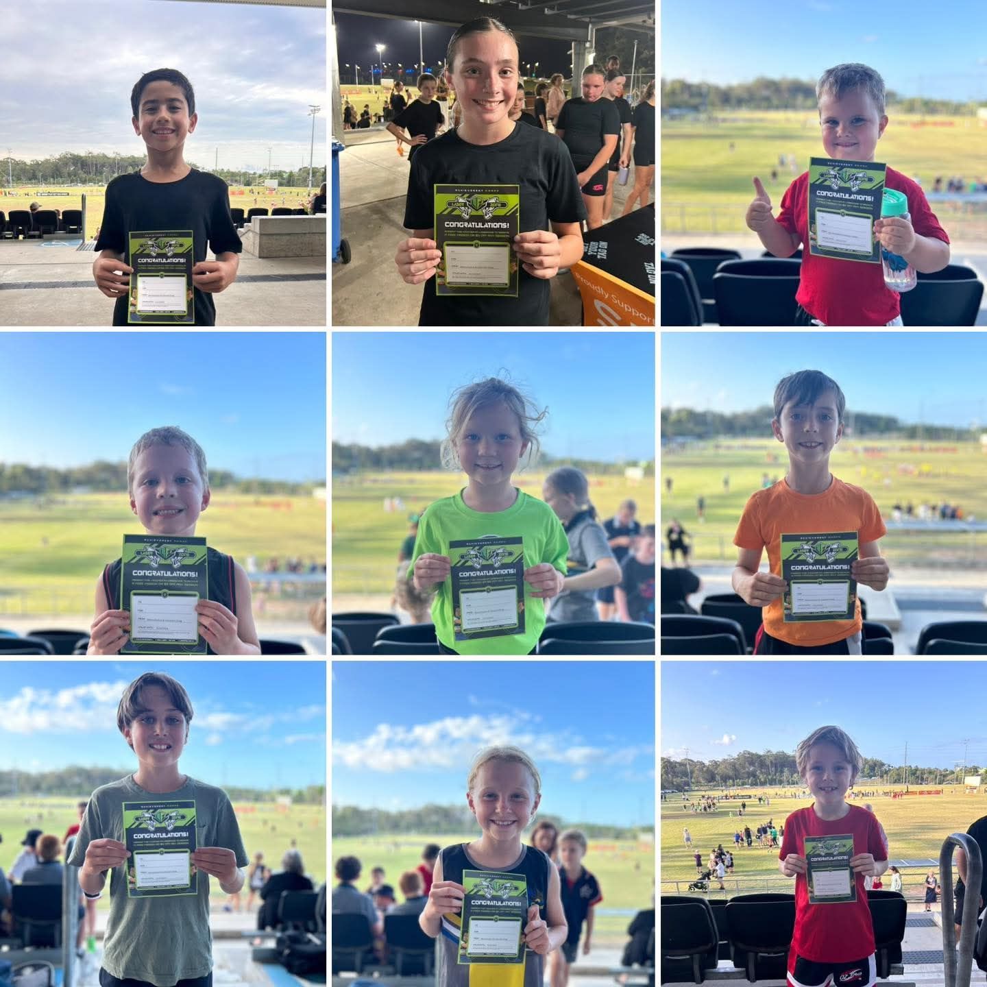 Nine children holding Laserzone achievement awards. Some smiling, posing with thumbs up, near a field.