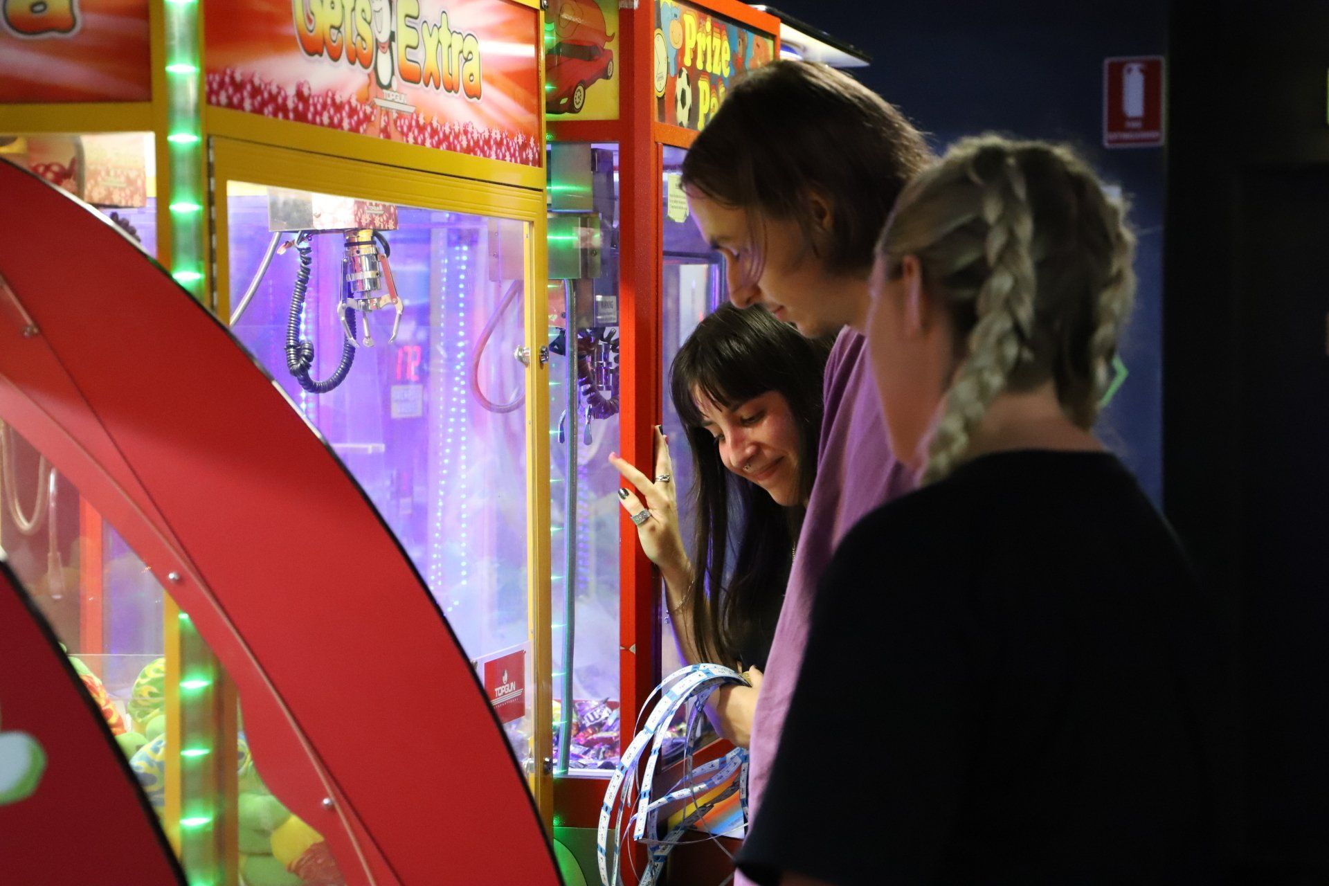 Young adults enjoying playing arcades