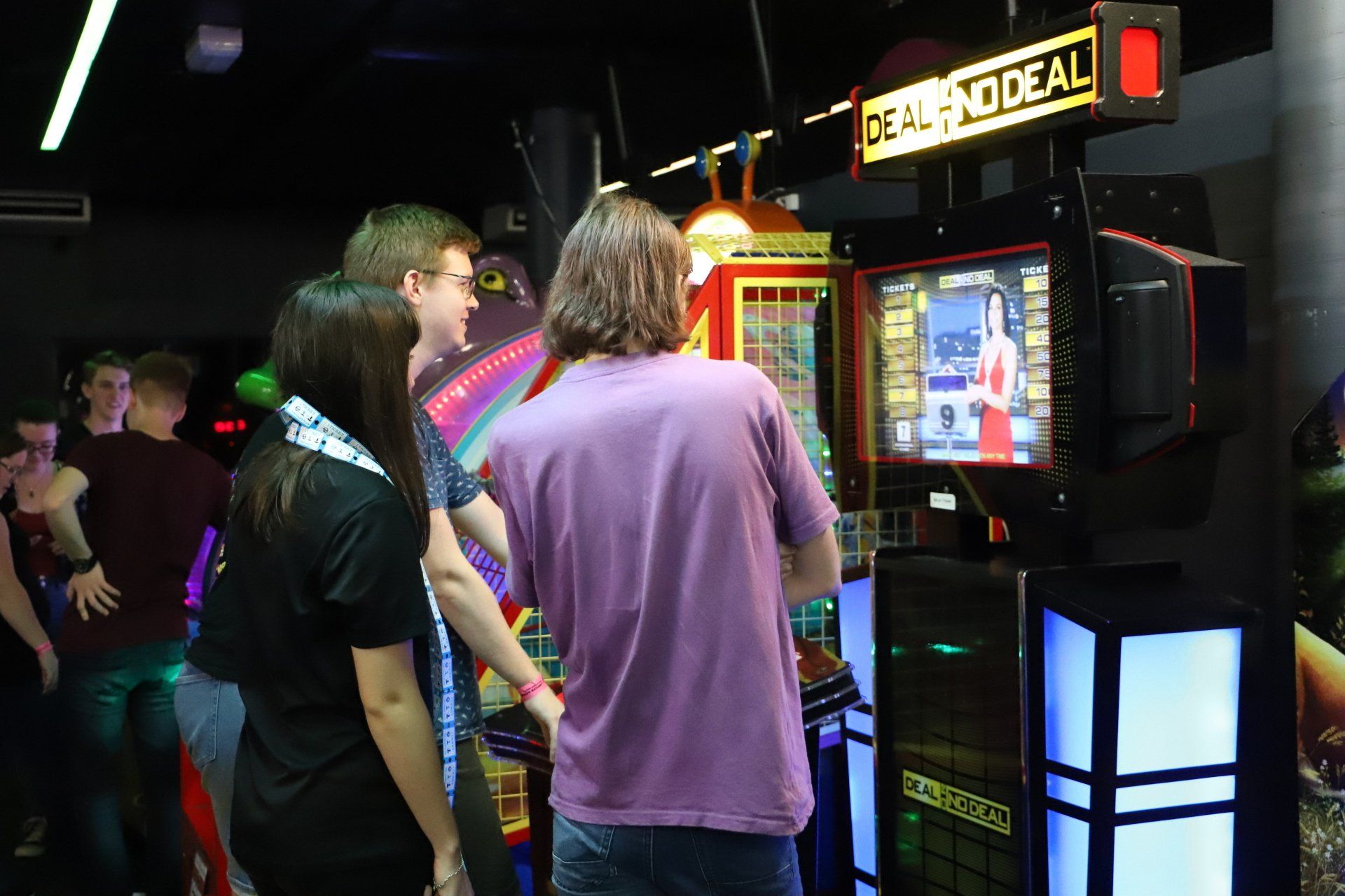 Young adults playing arcades