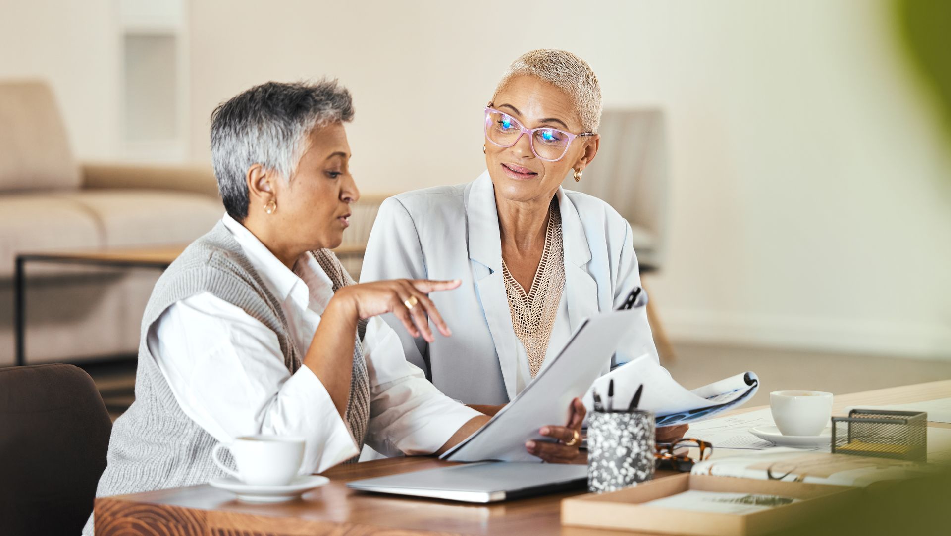 Two older female entrepreneurs discussing their business