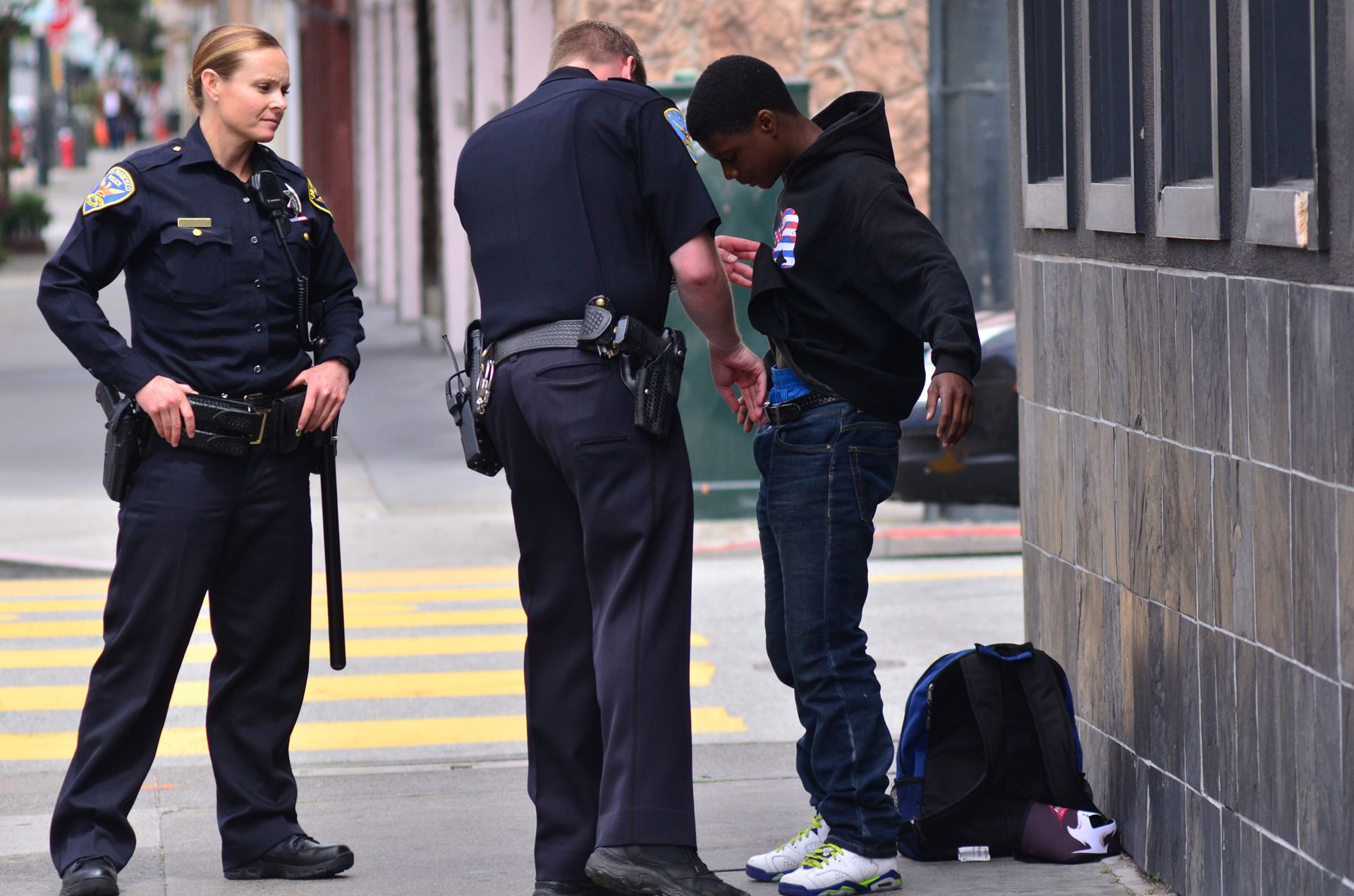 Officers patdown adult black American