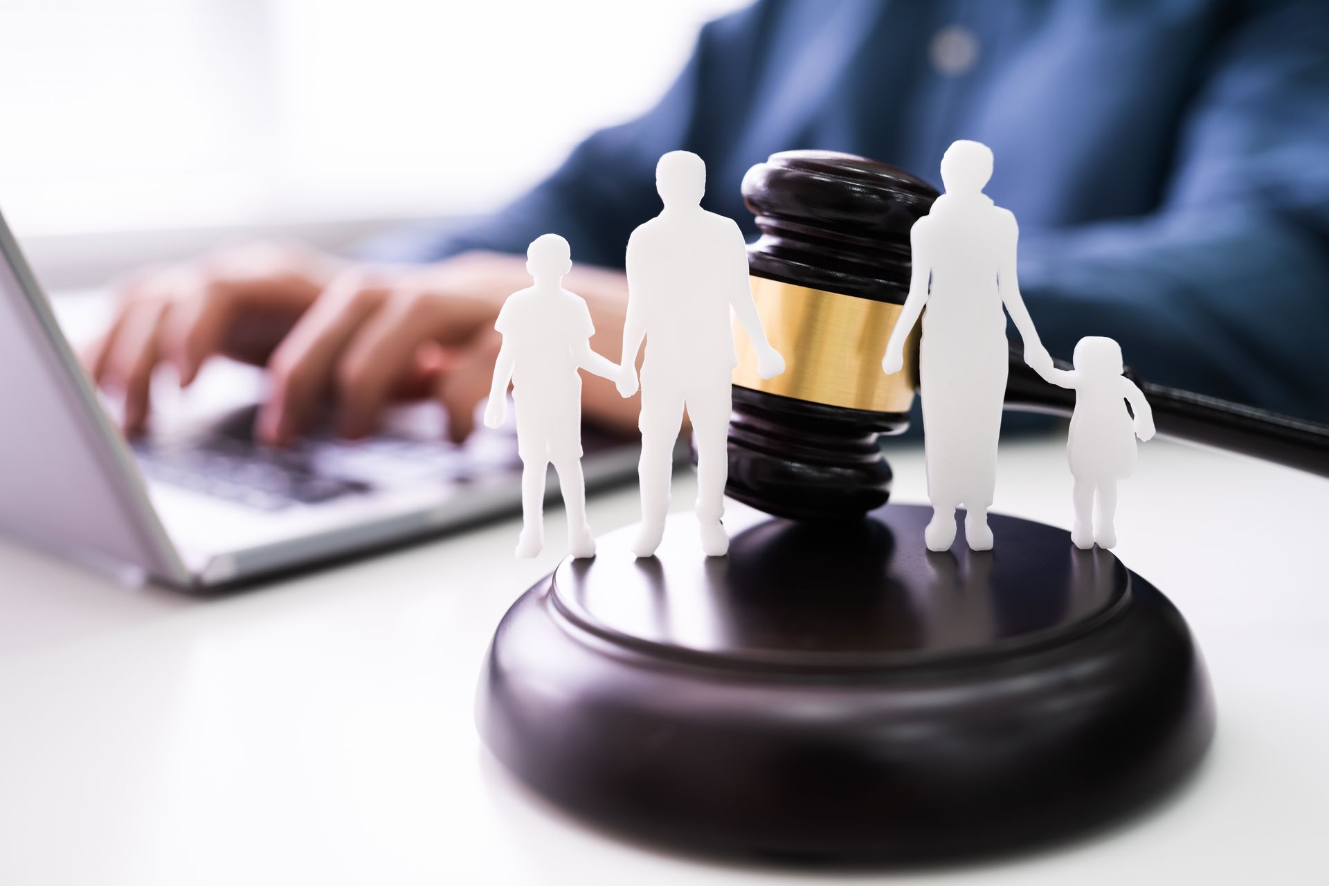 Separation Of Family Silhouette With Gavel In Courtroom