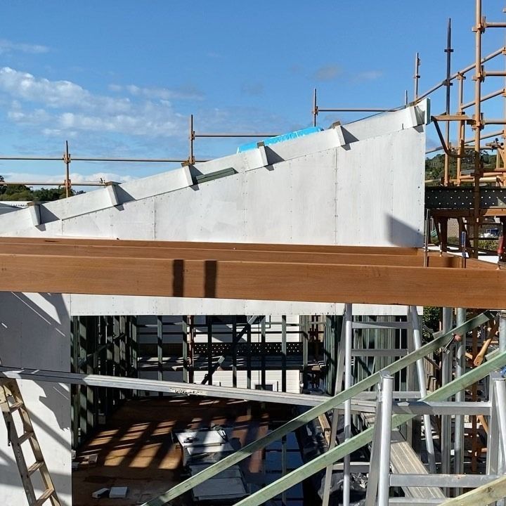 A Building Under Construction With Scaffolding And Wooden Beams — JC Coastal Construction In Coorabell, NSW