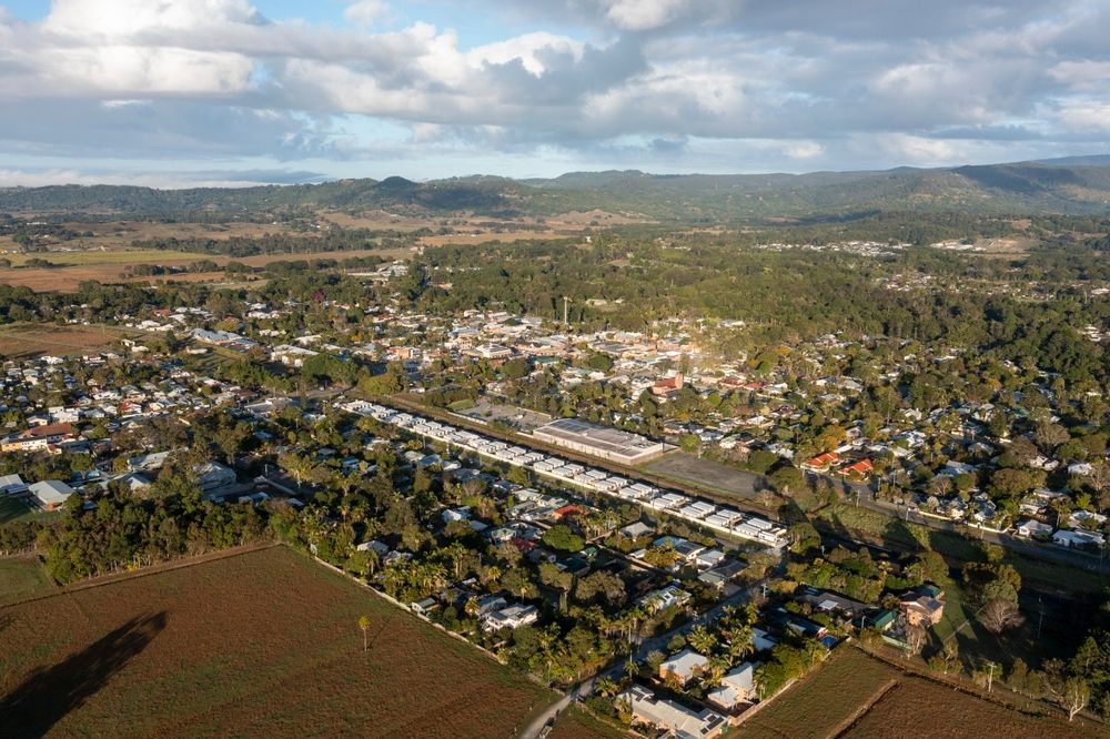 An Aerial View Of A Small Town With Mountains In The Background — JC Coastal Construction In Mullumbimby, NSW