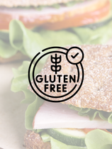 A close up of a gluten free sandwich on a plate.
