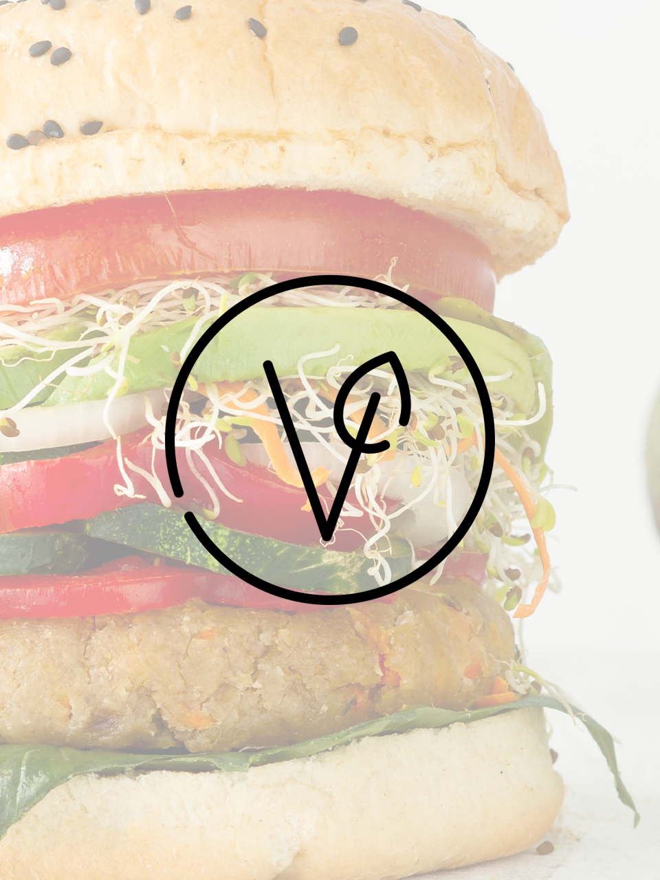 A close up of a hamburger with the letter v on it