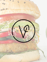 A close up of a hamburger with the letter v on it