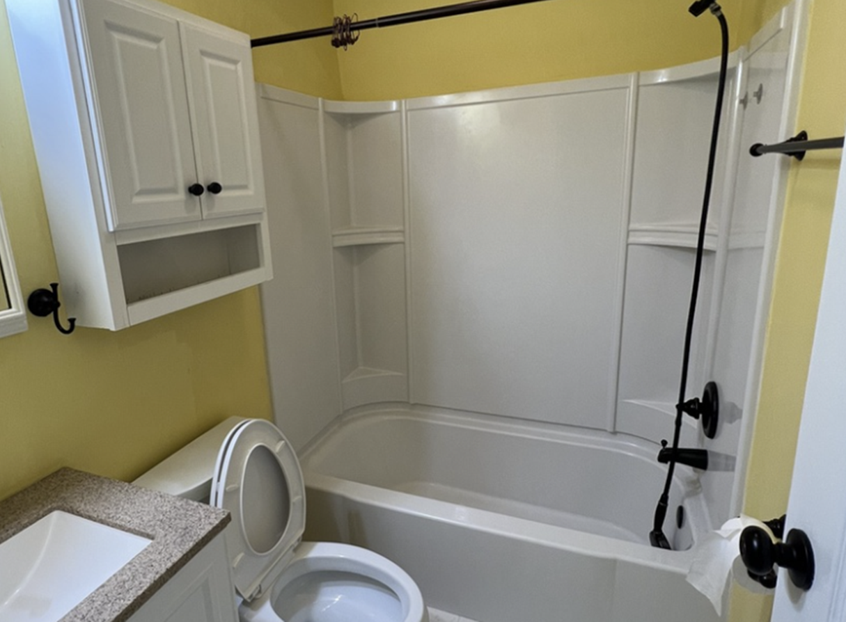 Freshly painted bathroom featuring yellow walls and white trim in Downingtown PA
