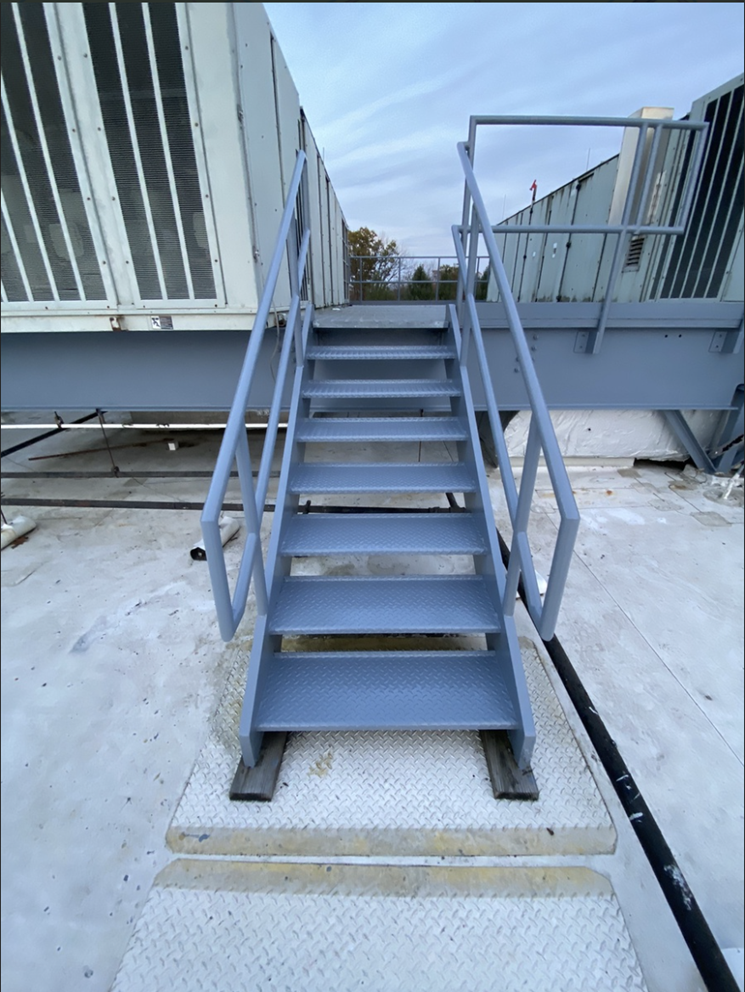 metal stairway on rooftop freshly painted in West Chester by Van Horn Painting