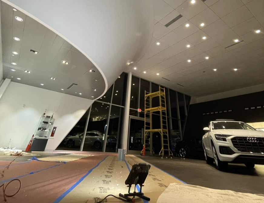 Luxury car dealership being painted