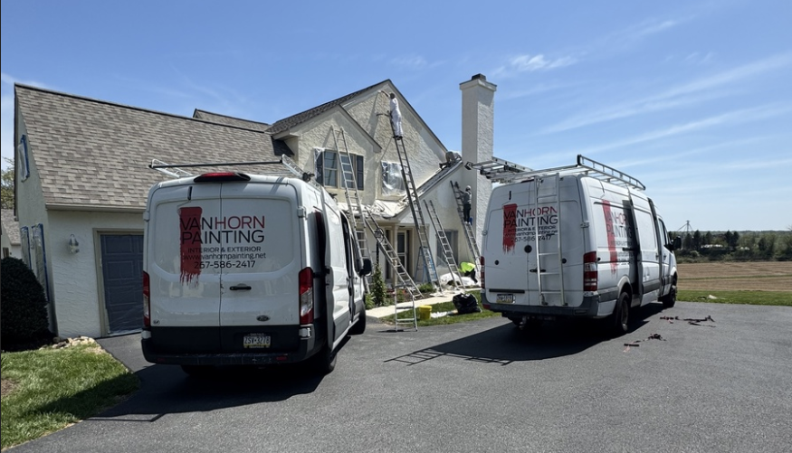 Van Horn Painting Vans parked outside a home