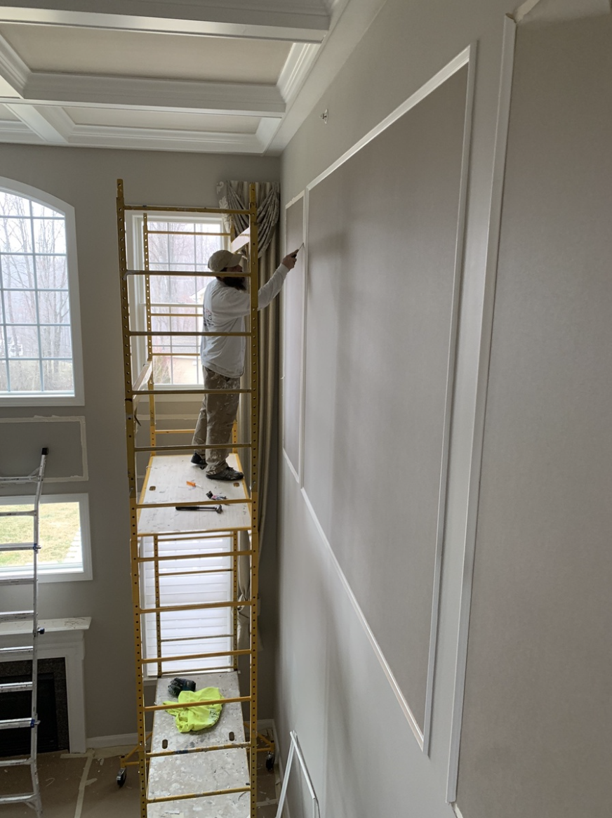 Professional Van Horn Painting expert on high scaffolding in double height ceiling