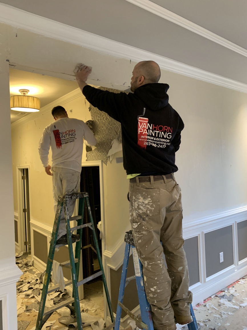 Van Horn Painting professionals on ladders during interior painting project