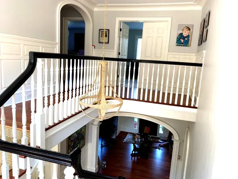 A view of a staircase from the second floor of a house