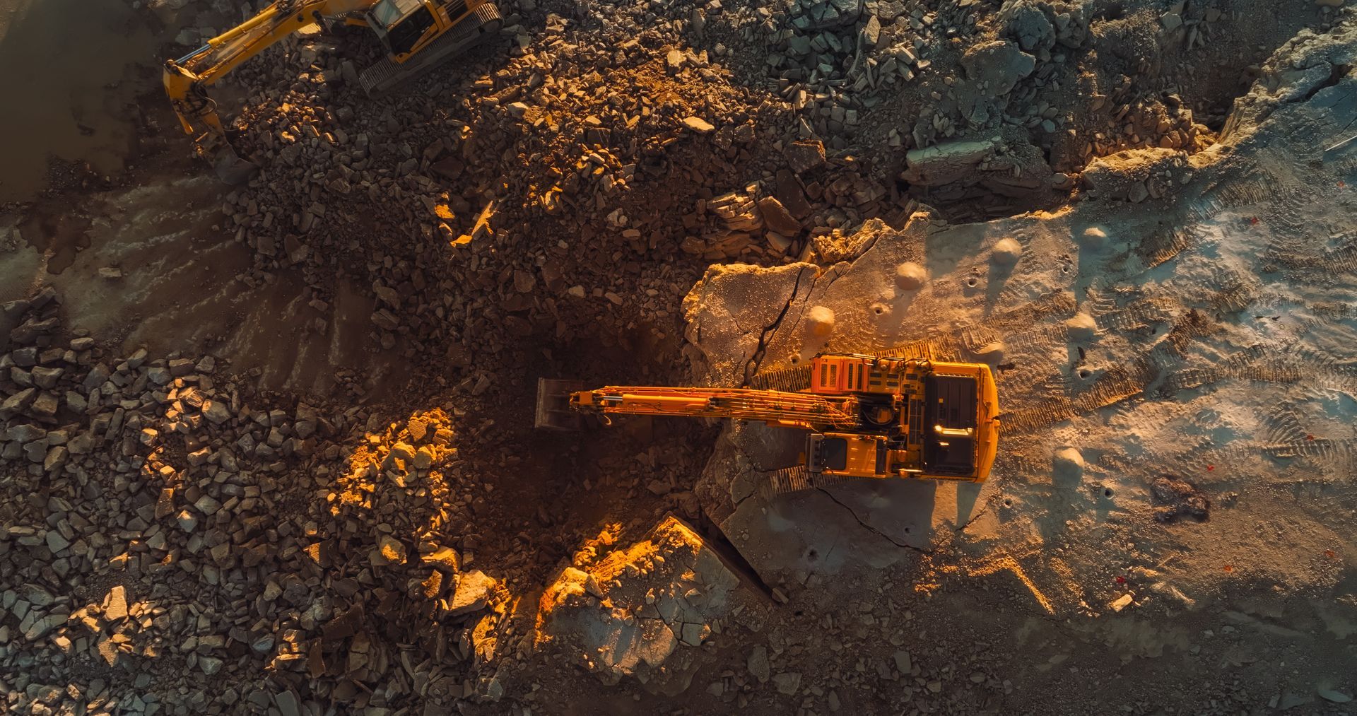 Commercial excavation contractor operating an excavator on a commercial jobsite