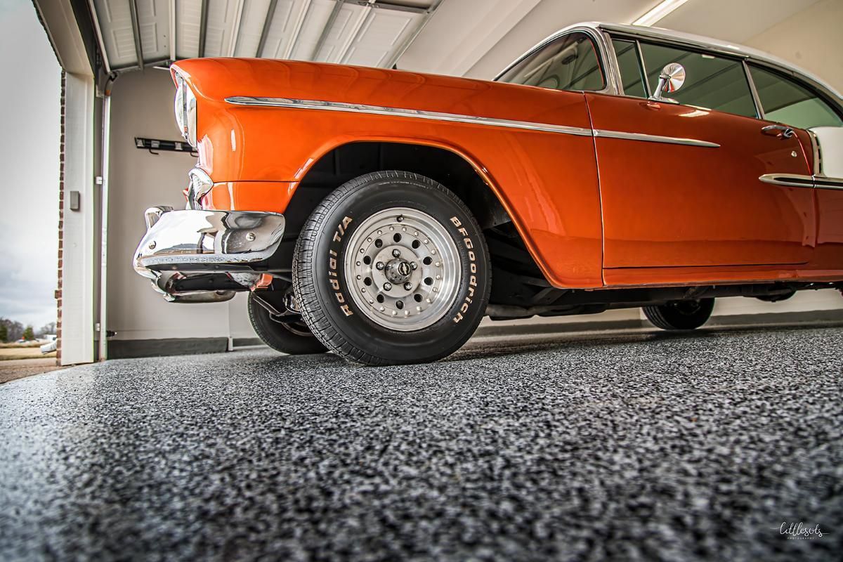 Orange classic car in a garage with epoxy garage floor