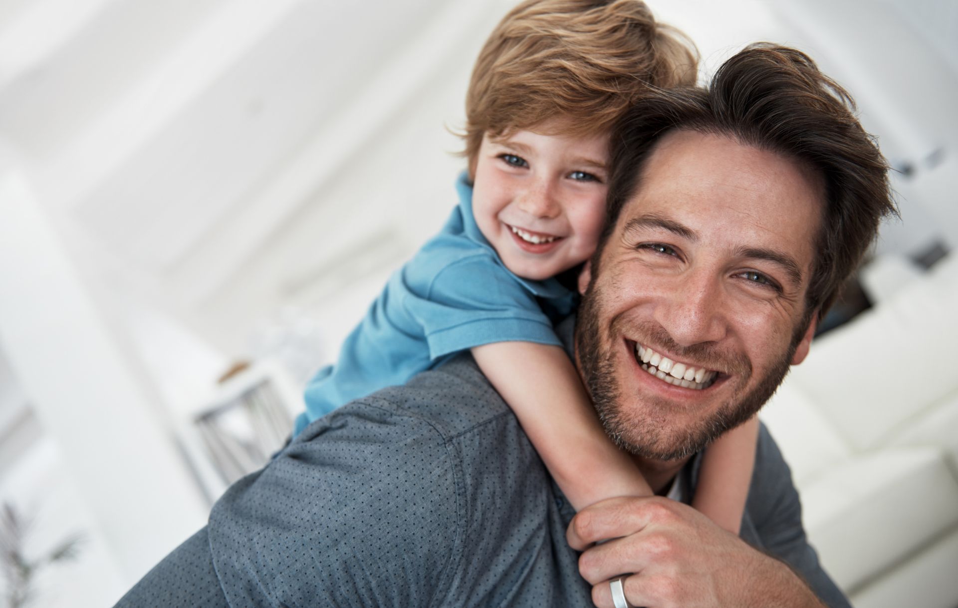 A Happy Father Giving His Son A Piggyback - Beatrice, NE - Gleason Dental Clinic