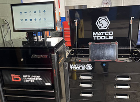 Workstation with computer monitor and black Matco Tools tool chest and drawers in a garage workspace | Diamond Automotive