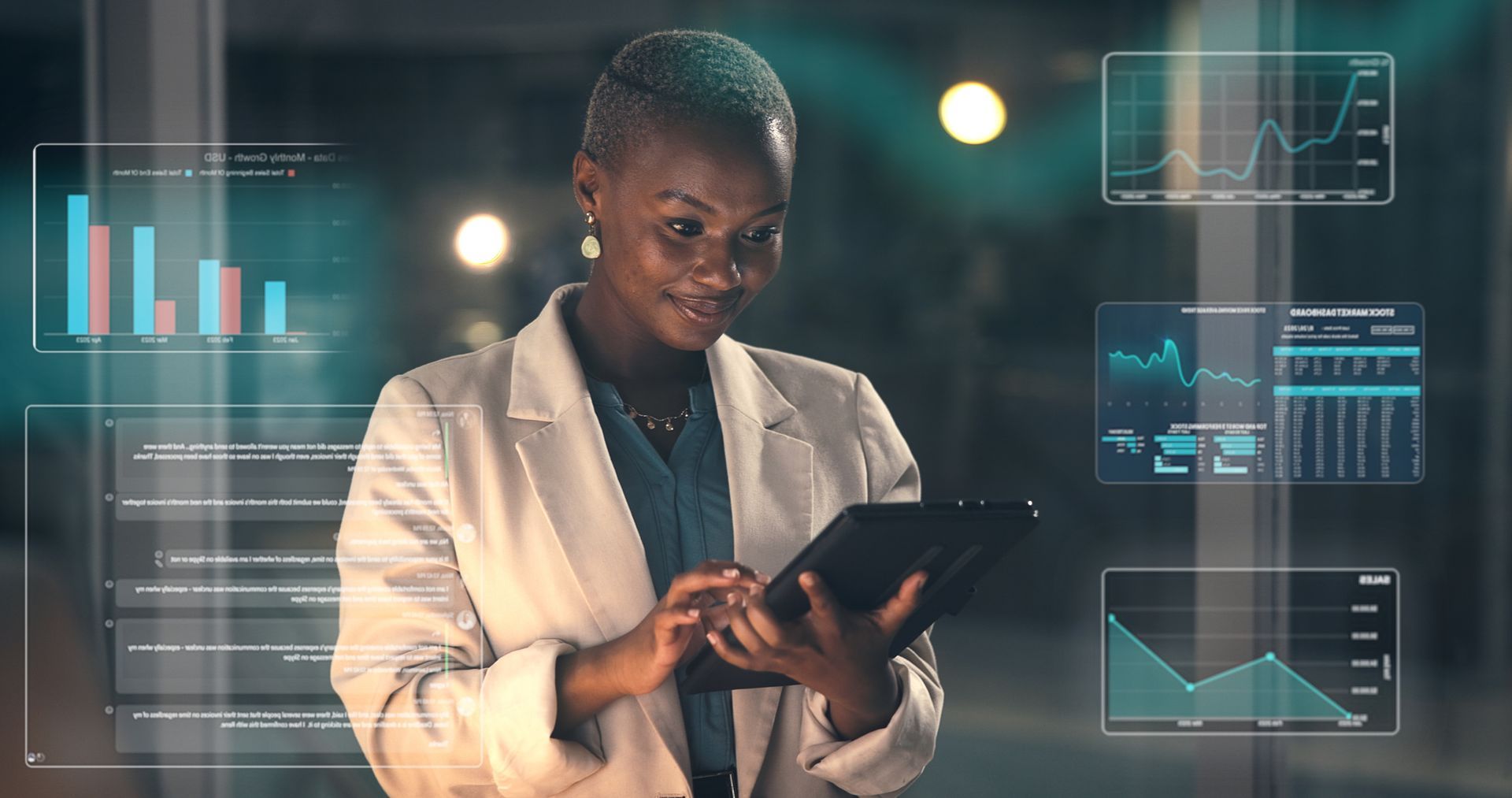 Professional person using a tablet with data dashboards overlaid in a dim office setting