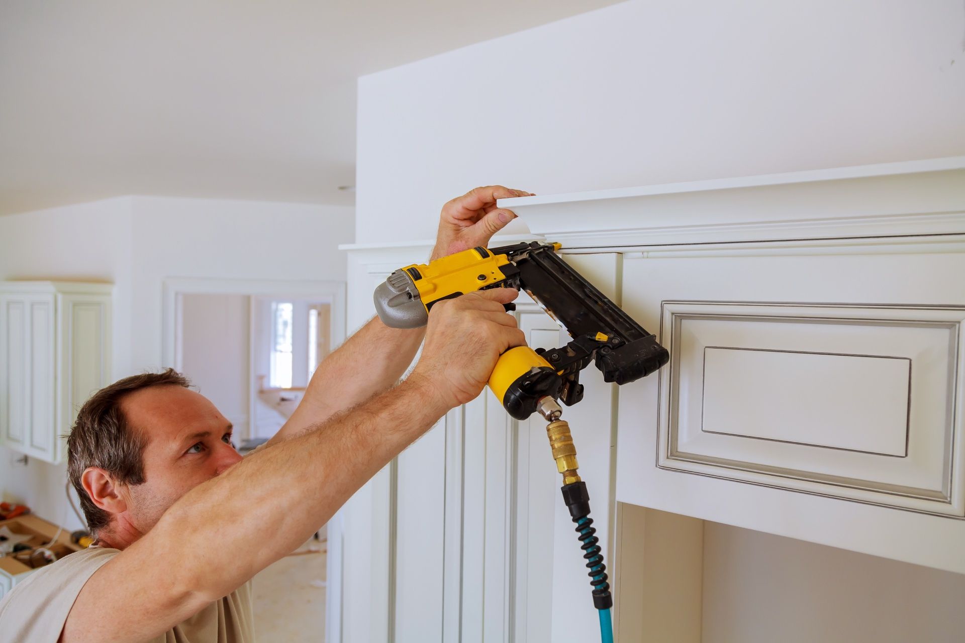 A man using a nail gun