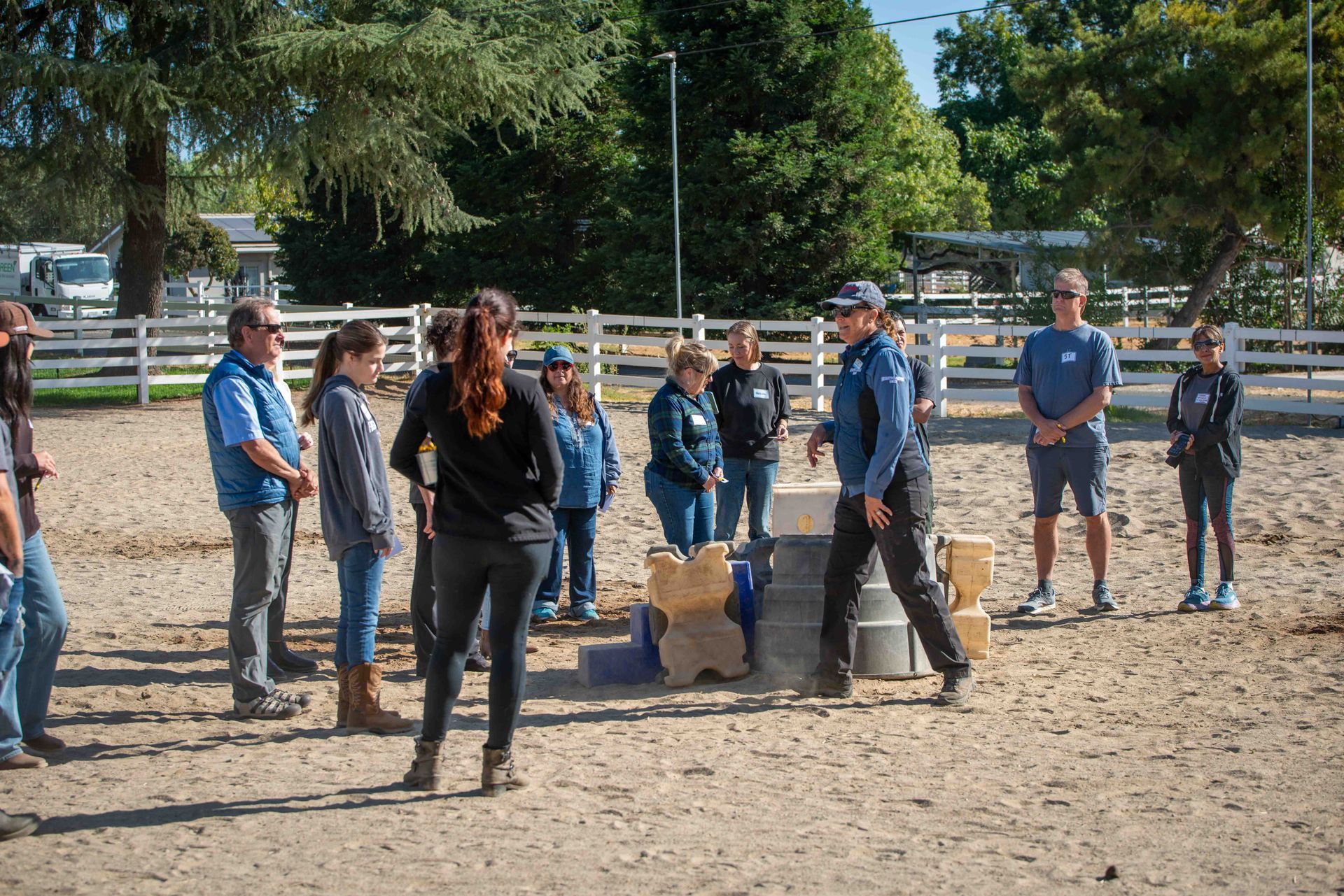 Visitors learning how rescued horses support Equine Assisted Psychotherapy