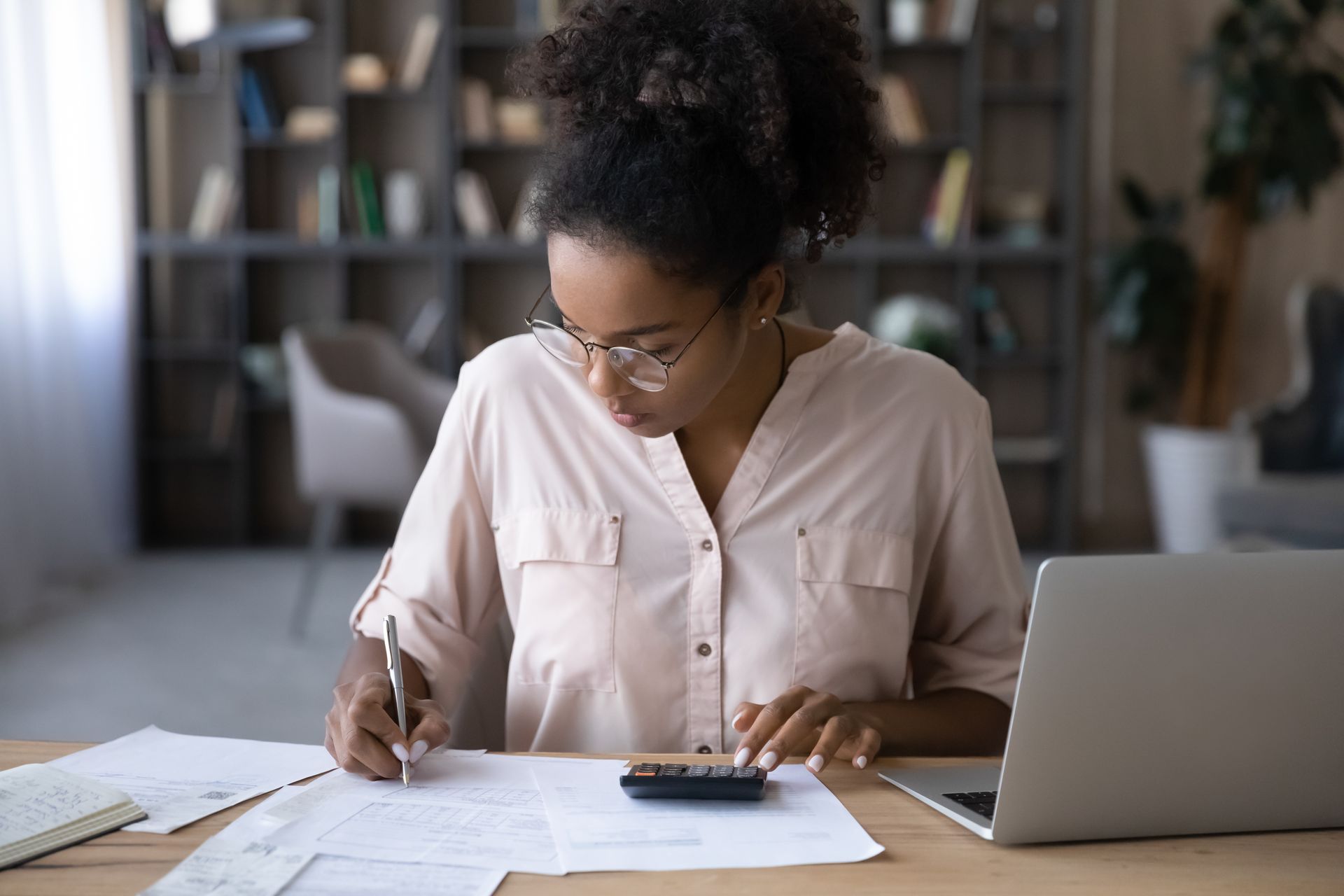 Establish a budget first when looking for an apartment in kenosha - a woman budgeting