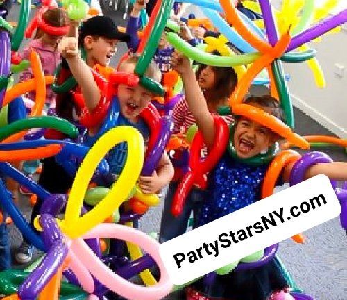A group of children are playing with colorful balloons.
