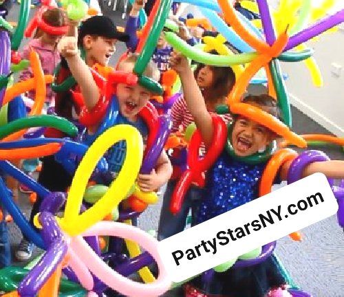 A group of children are playing with balloons and the website partystarsny.com is in the corner