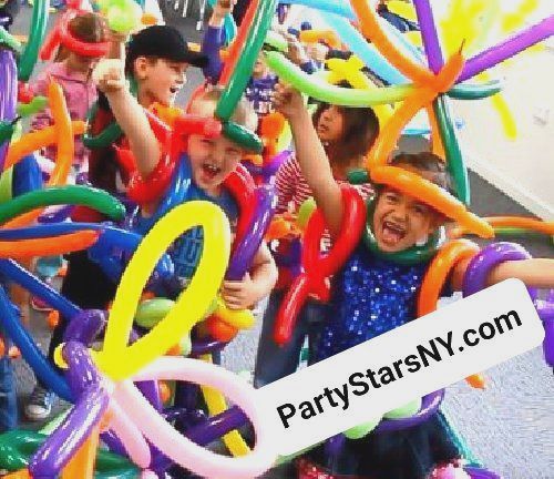 A group of children are playing with balloons and a sign that says partystarsny.com