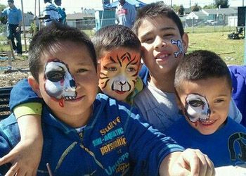 A group of young boys with their faces painted