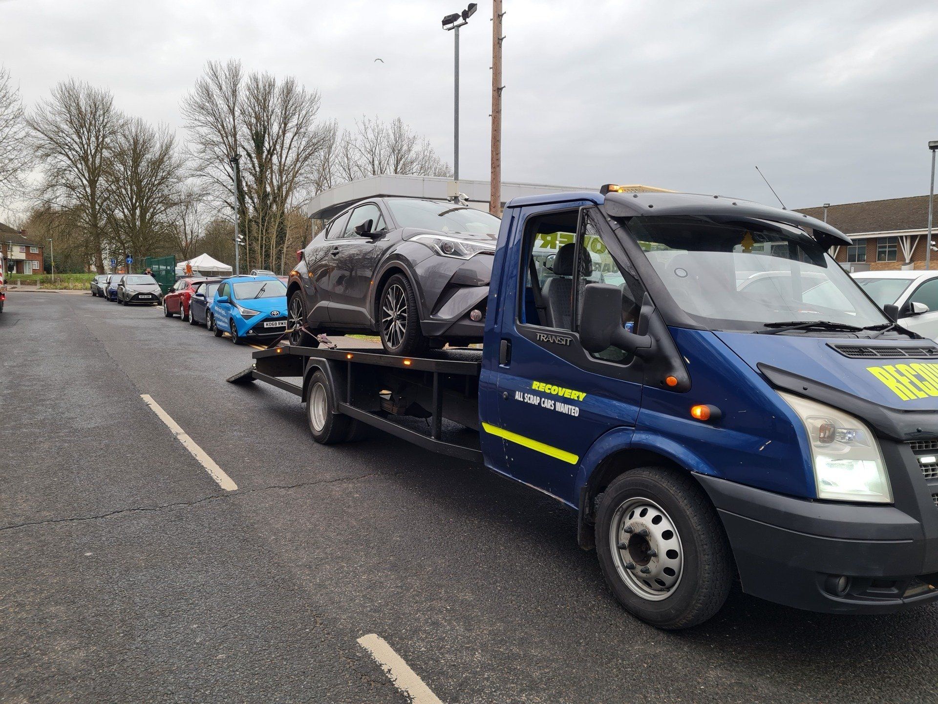 Black car on a pick-up van