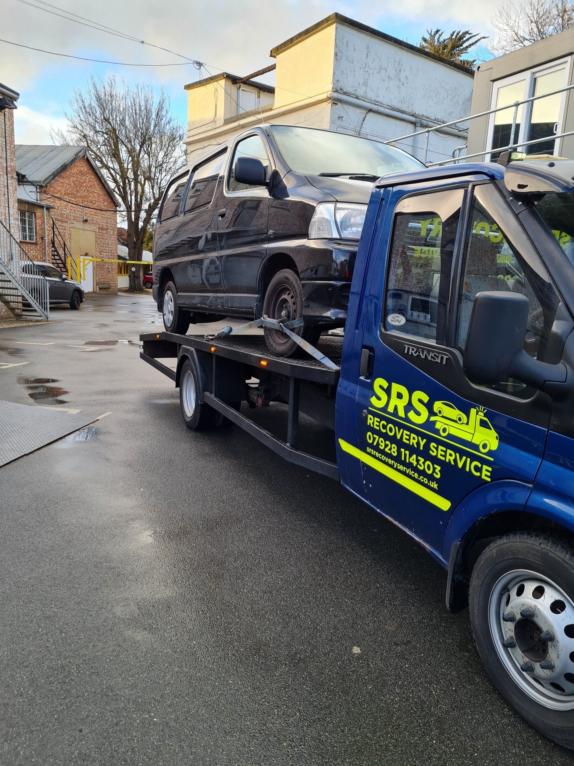 black car on a pick-up lorry