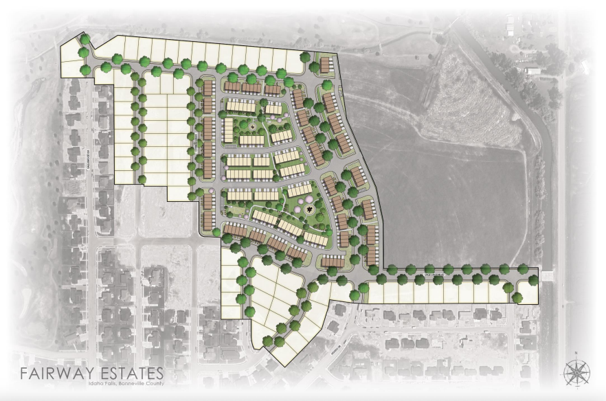 Plan view of a residential development with colored blocks for different building types and green spaces.