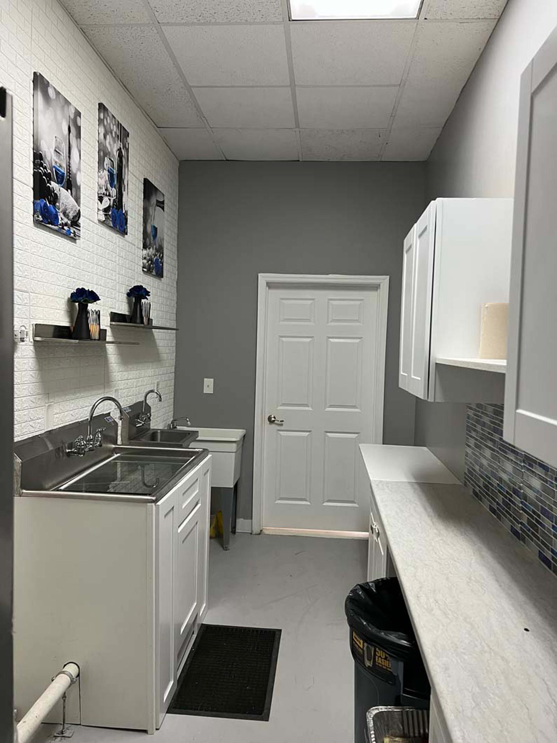 A kitchen with a sink and cabinets