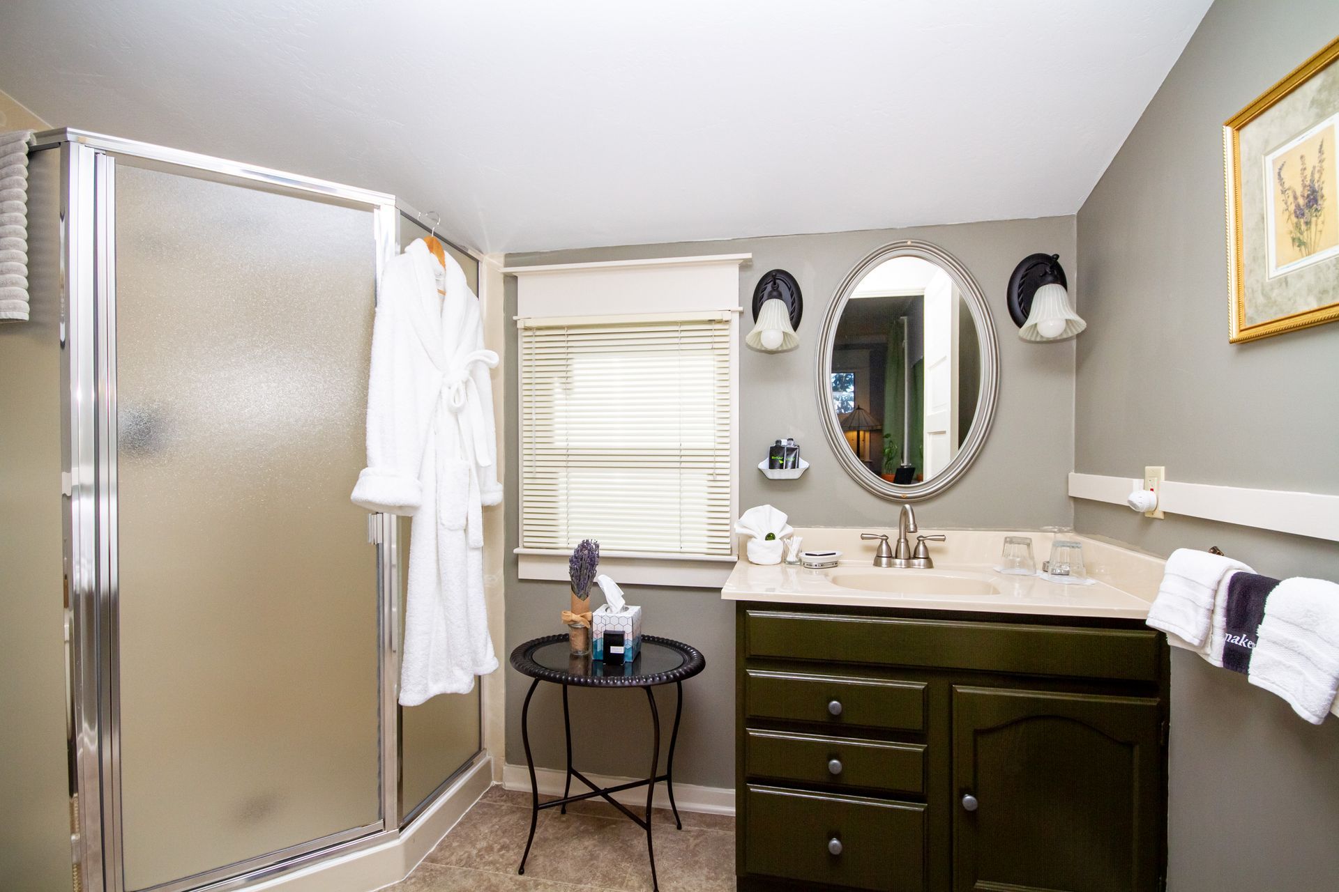 The bathroom in the Lavender Room, showing the walk in shower and the vanity.