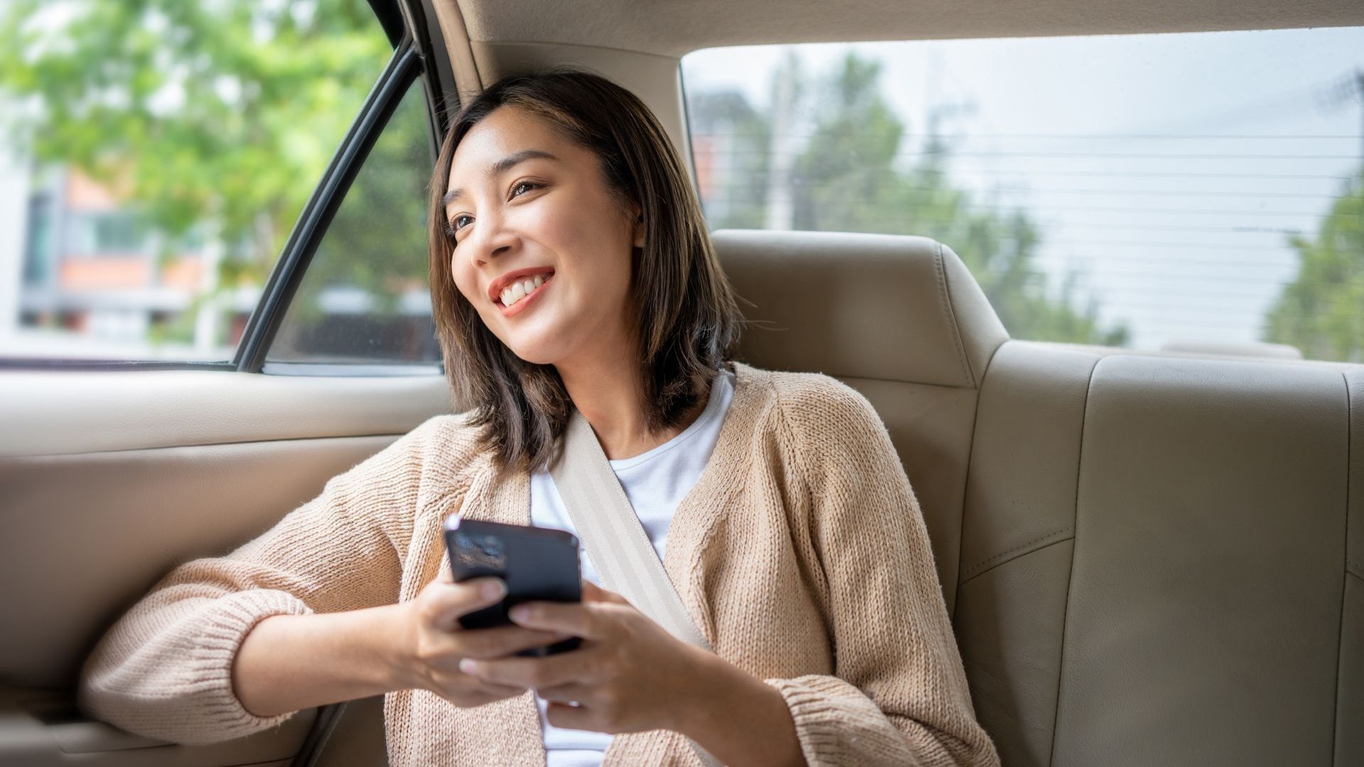 Woman on the back of a taxi
