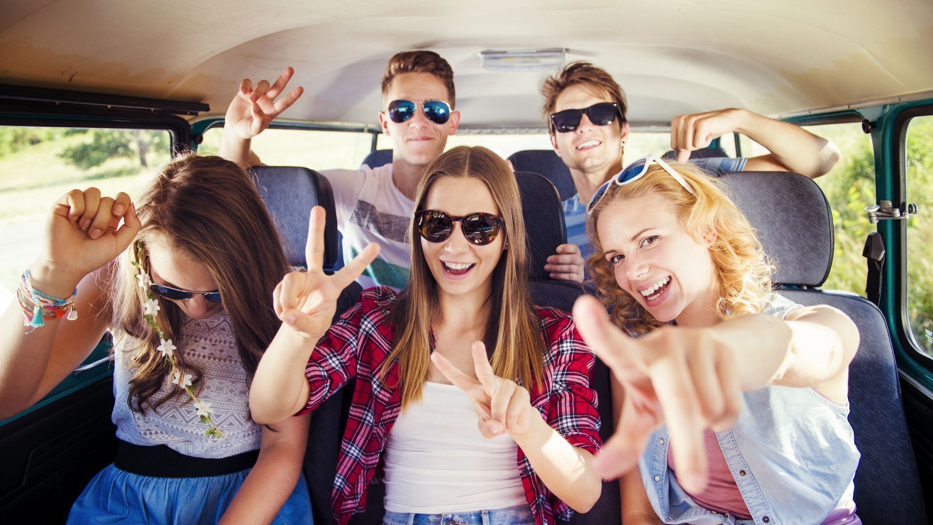Friends on the back of a van