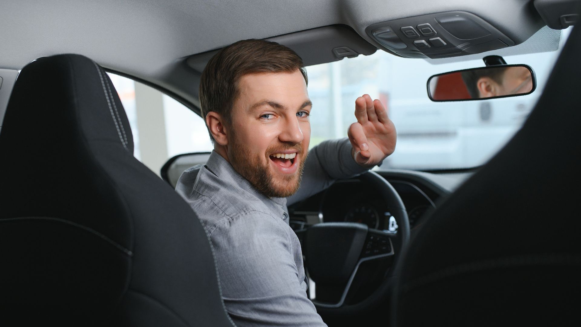 Driving smiling to a passenger
