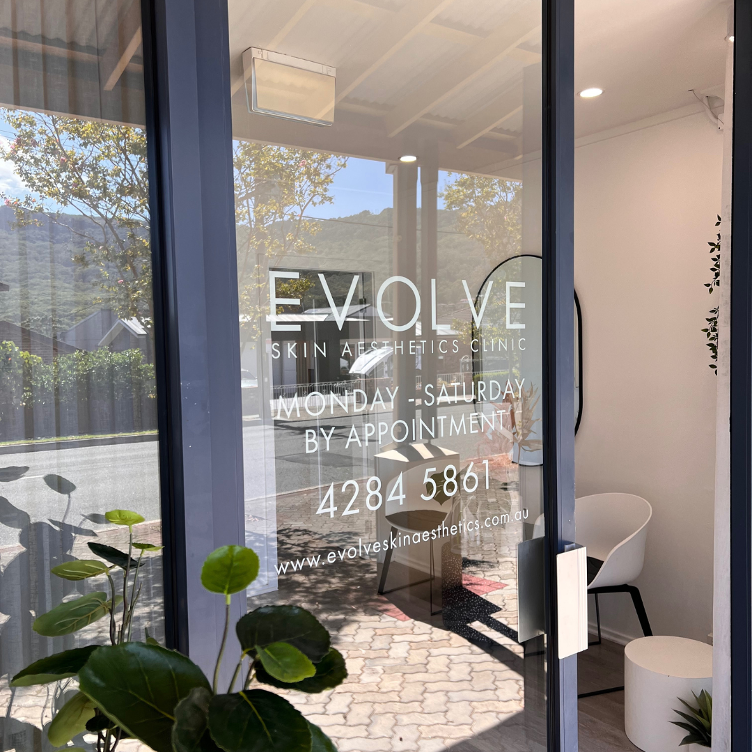 Evolve Skin Aesthetics Clinic decal on glass door