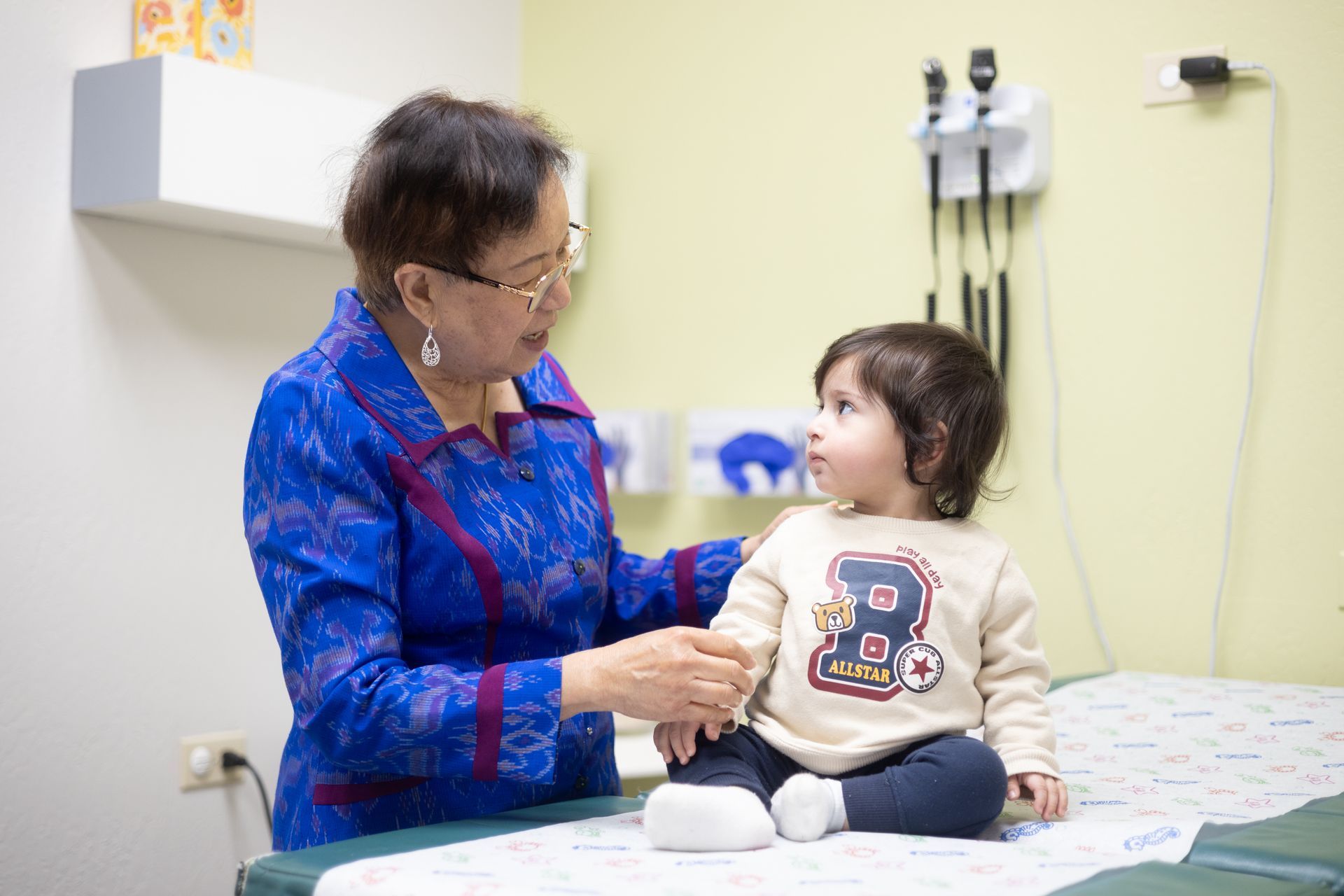 A doctor with a small child