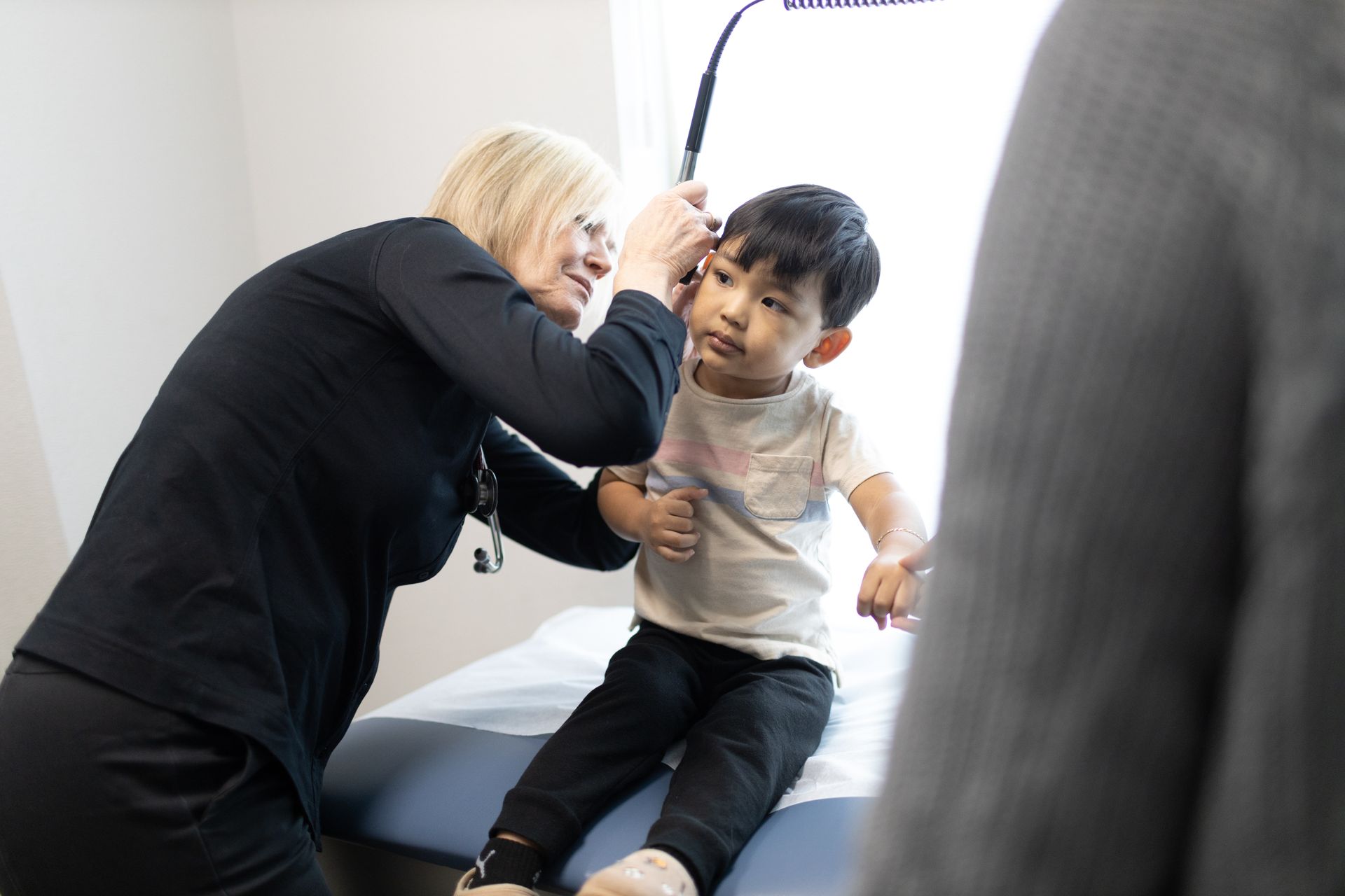 A child is being examined on a table