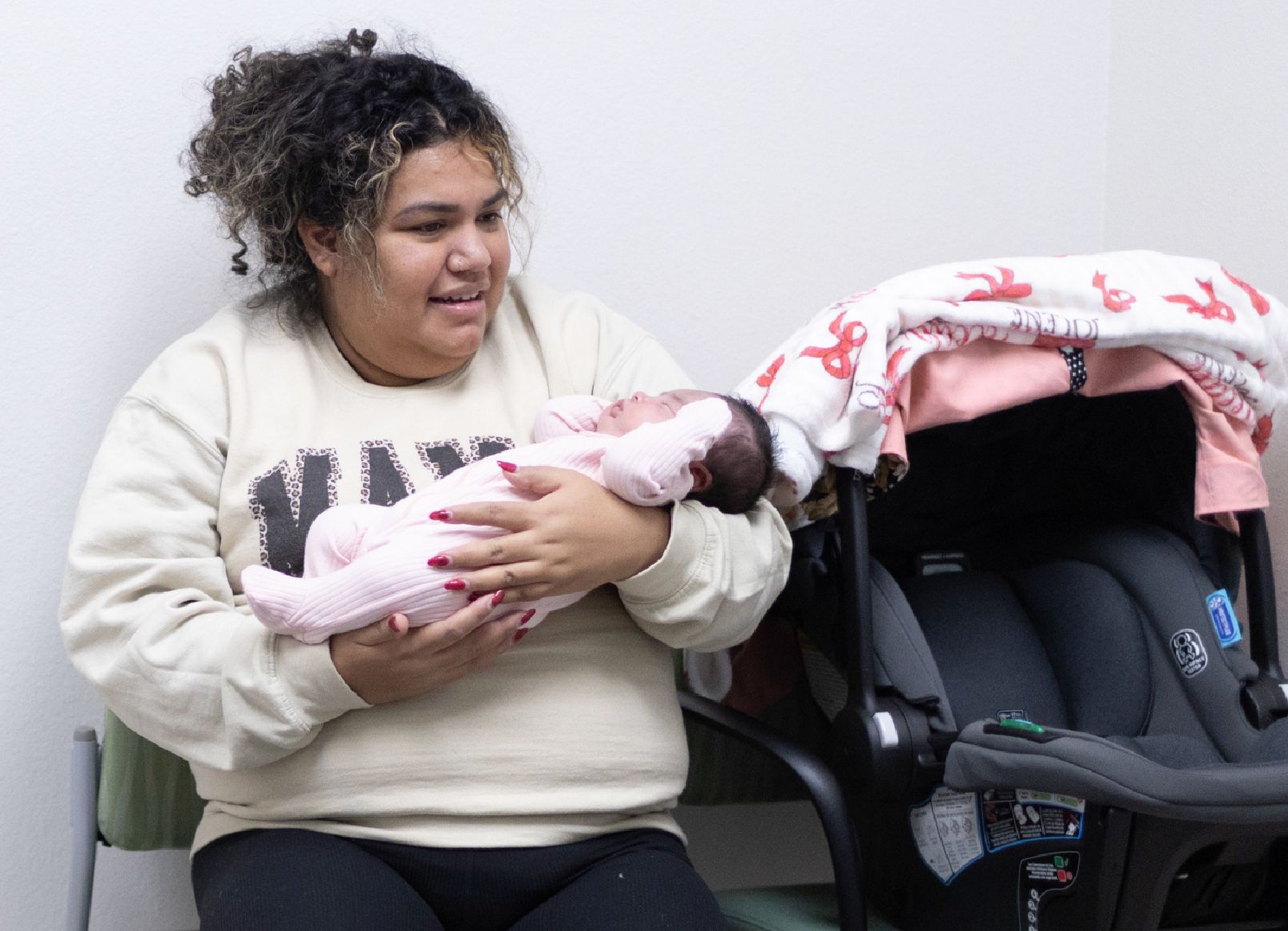 A newborn baby is being examined