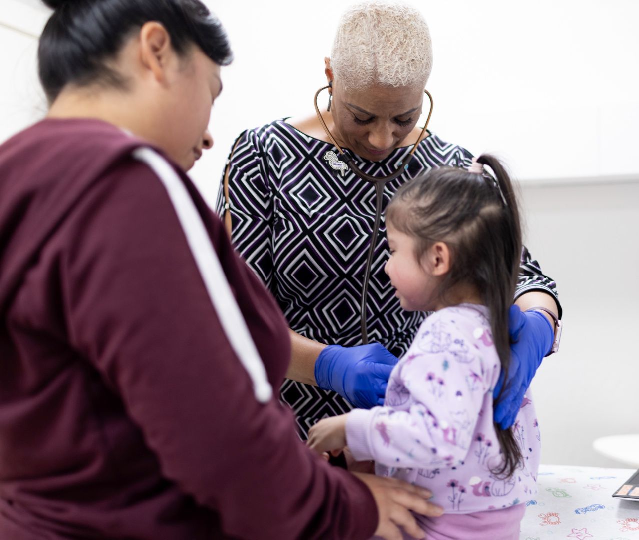 A little girl being examined