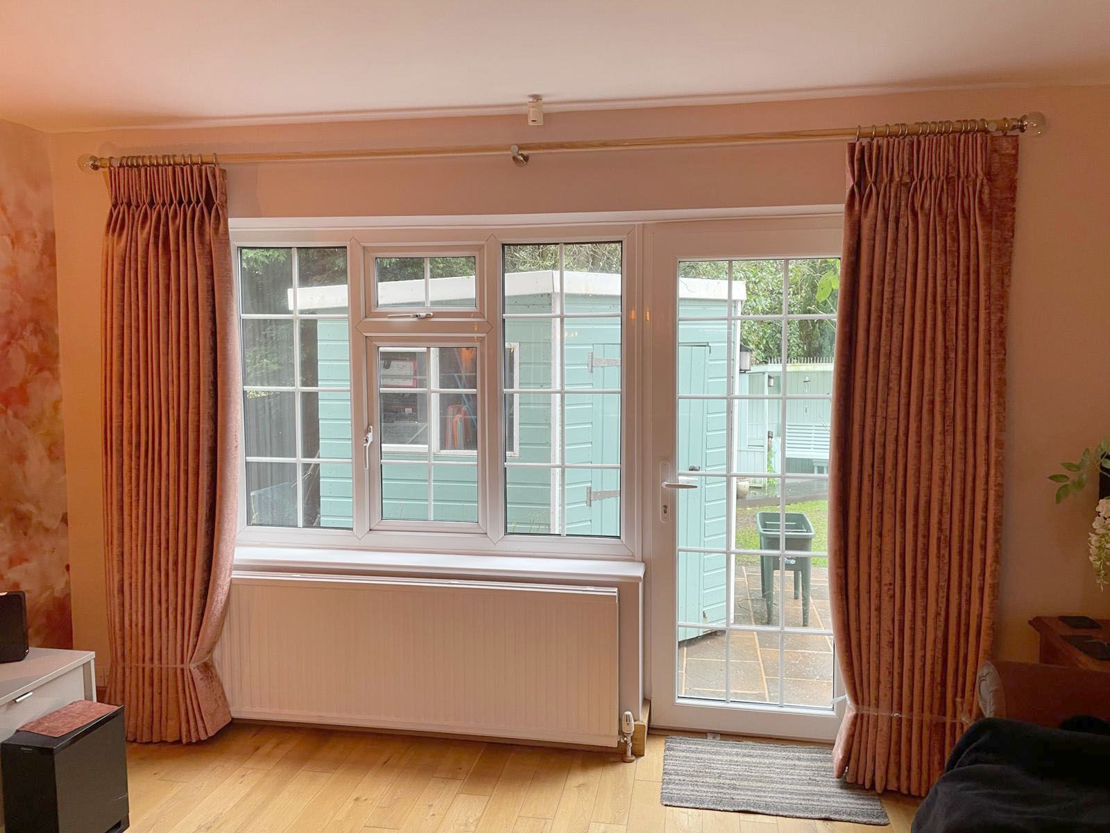 Twin pleat curtains on oak pole