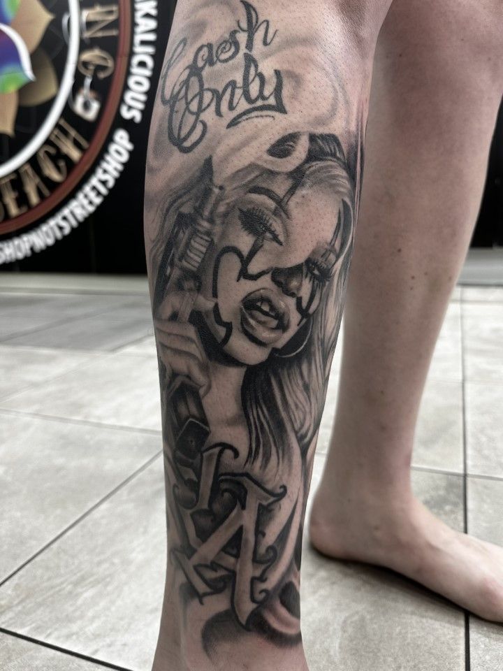 Tattoo on leg: woman with clown makeup — Whitsunday Tattooing Airlie Beach in Airlie Beach, QLD