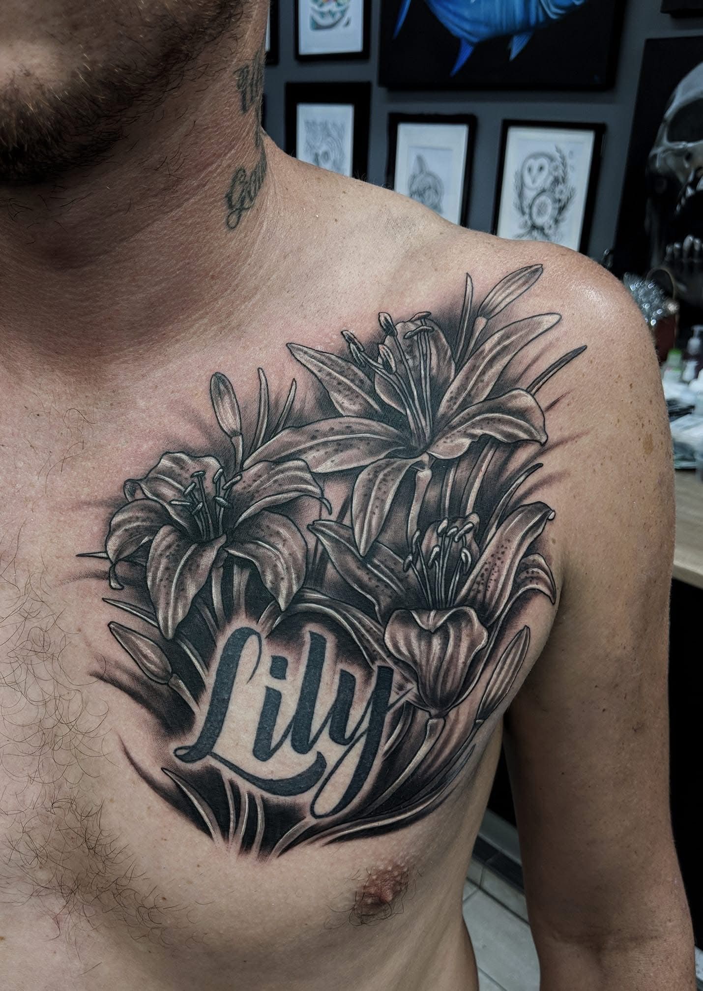 Tattoo of lilies and the name 
